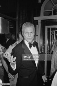 American comedian Joe Piscopo, wearing a tuxedo with a bow tie, attends the party celebrating the 10th anniversary of the 'Catch a Rising Star' comedy club in New York City, New York, 19th August 1982. The event was filmed for a television special marking the landmark anniversary of the famed club. (Photo by Vinnie Zuffante/Michael Ochs Archives/Getty Images)